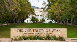 University of Utah Presidents' Circle Entrance sign with trees and building in background.