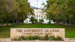 University of Utah Presidents' Circle Entrance sign with trees and building in background.