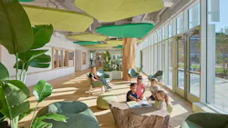 Daylit seating area with students reading among plants and biophilic acoustic ceiling panels in the shape of plants.