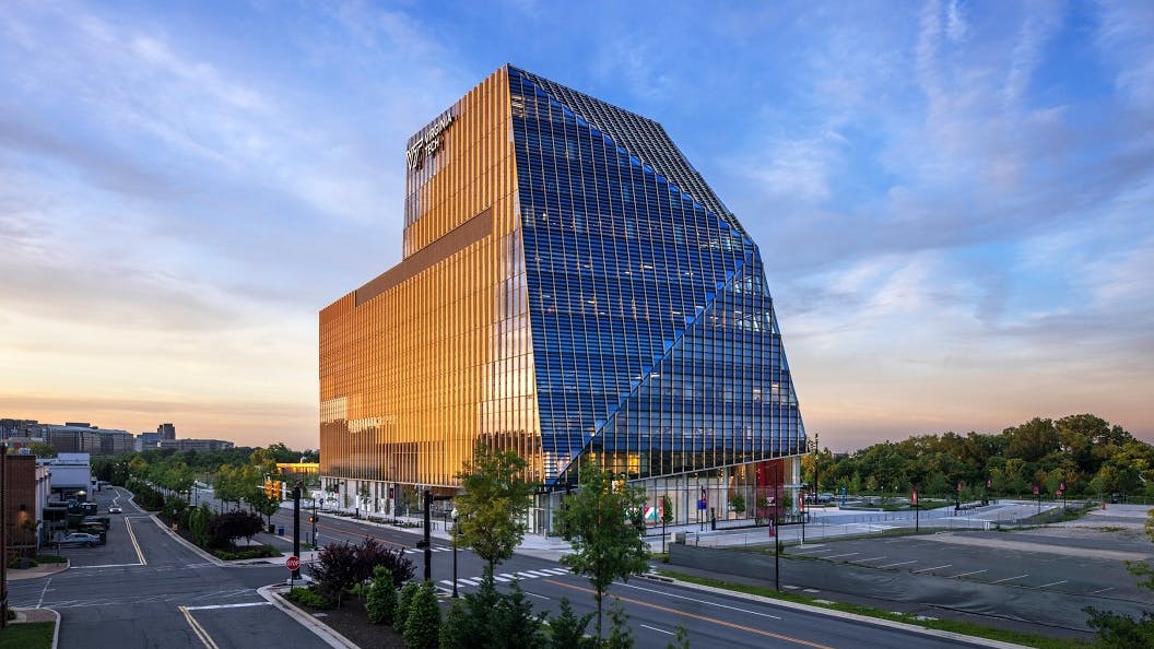 Exterior of new Academic One Building at Virginia Tech at dusk.