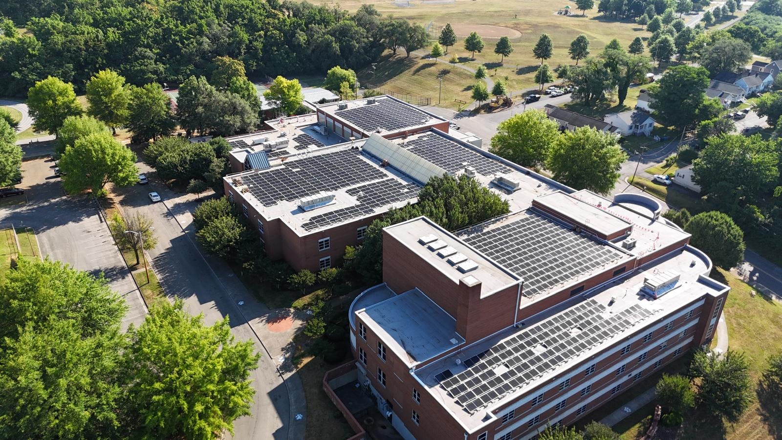 Aerial view of Virginia middle school with massive solar panel array.