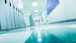 Empty college school hallway with lockers, low angle view from floor.