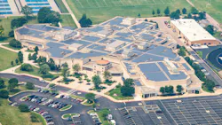 Aerial view of Lake Park High School campus with extensive solar panel array.