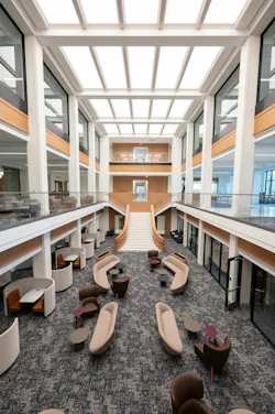 Two-story, atrium space with skylights above and lounge seating below allows for a variety of uses.