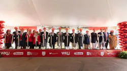 Group photo at groundbreaking of new facility at Western Kentucky University in which people are wearing hard hats and holding shovels.
